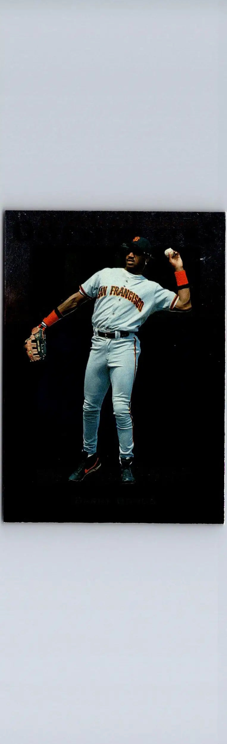 Baseball player Barry Bonds in San Francisco Giants uniform throwing a ball in Upper Deck 1997 card