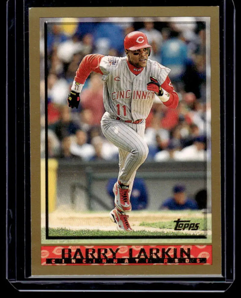 Baseball card of Barry Larkin in a gray road uniform for Cincinnati Reds