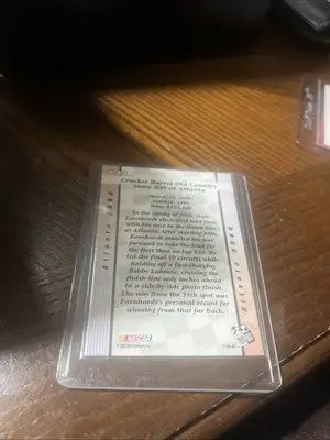 Encased trading card of Dale Earnhardt Sr from 2002 Press Pass Premium Atlanta Win