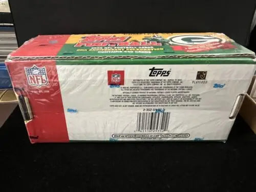 Sealed box of 2002 Topps football cards featuring Green Bay Packers rookies Aaron Rodgers