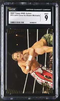 Graded wrestling card featuring WWE Action John Cena vs Shawn Michaels in Topps WWE Action series