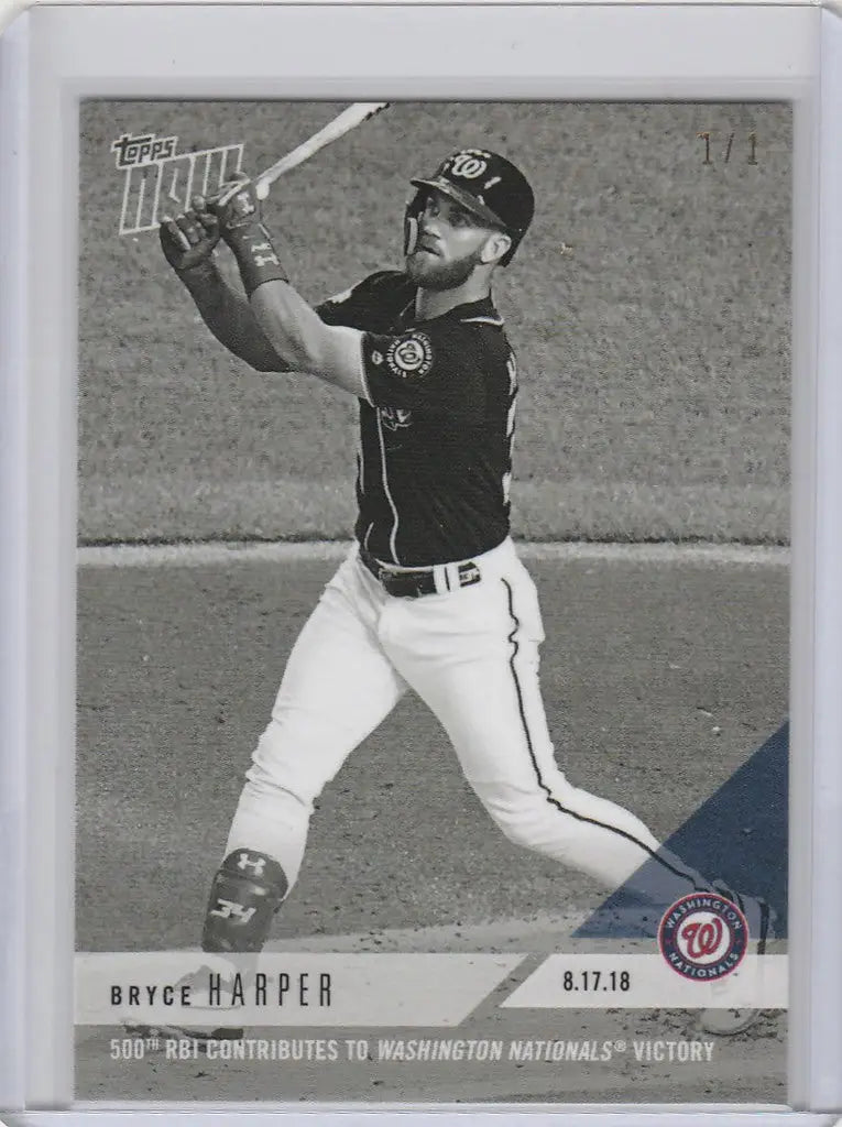 Baseball card of Bryce Harper mid-swing in black jersey, a top trading card collectible