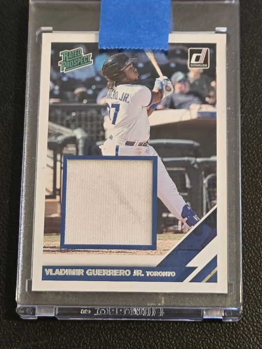 Baseball trading card featuring Vladimir Guerrero Jr. rated prospect material with game-used jersey