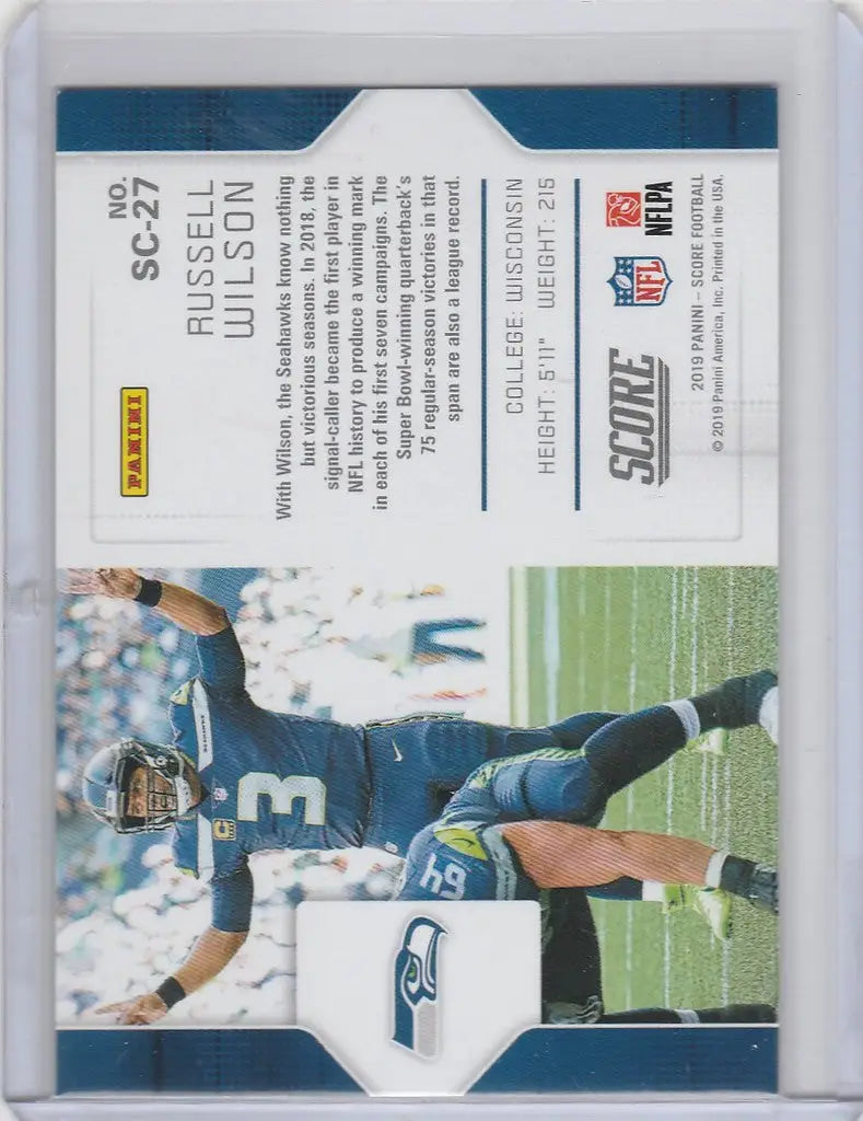 Football trading card of Russell Wilson Seattle Seahawks diving in blue uniform SC27