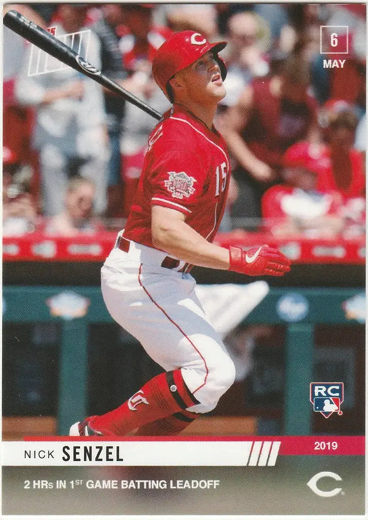 Baseball player in red Cincinnati Reds uniform hitting, featuring Nick Senzel 2HR