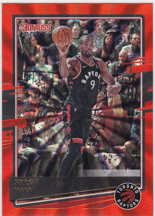 Basketball trading card of Serge Ibaka in action, featuring Ibaka Orange Laser design