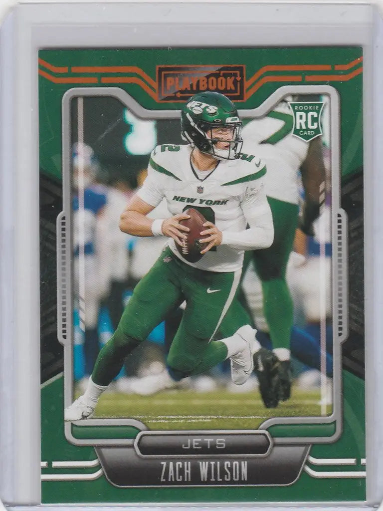 Football trading card of Zach Wilson in throwing stance from 2021 Panini Playbook Gold