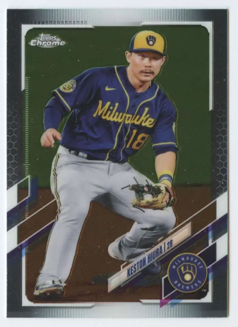 Baseball trading card of Keston Hiura fielding for Milwaukee Brewers in navy uniform