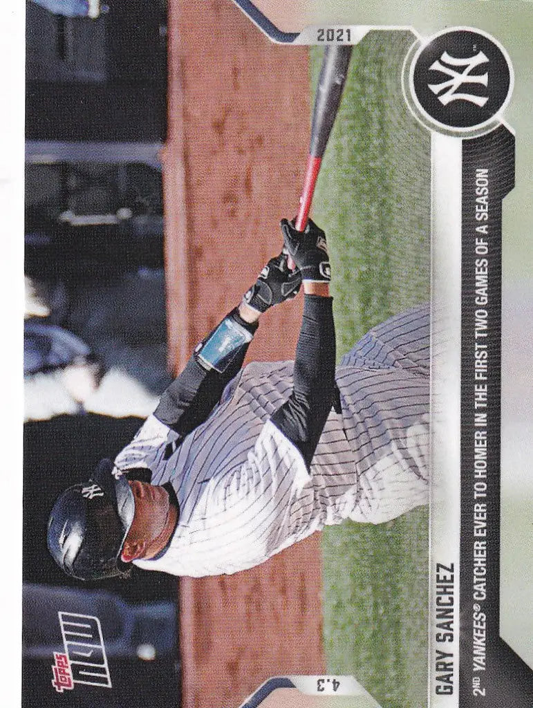 Baseball player Gary Sanchez swinging bat in white pinstripe uniform for New York Yankees