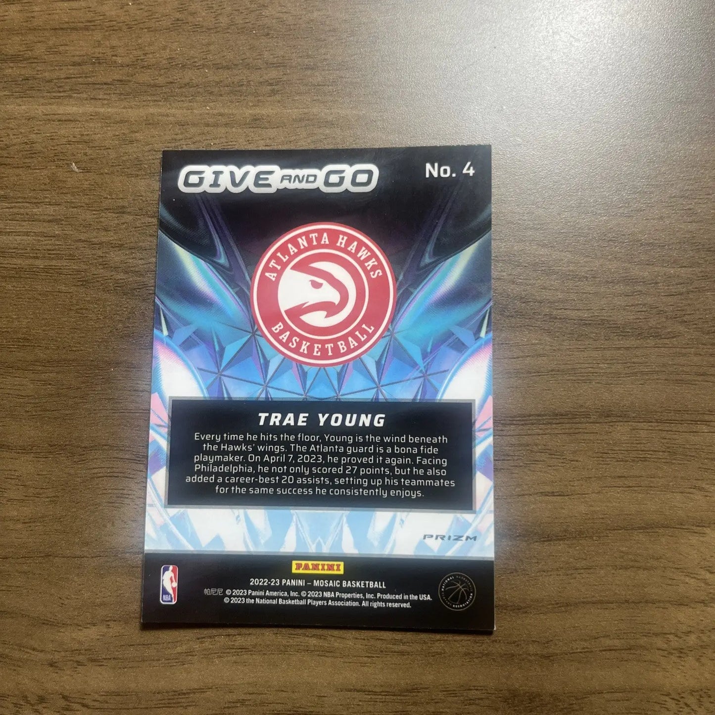 Trae Young basketball card from 2022-23 Panini Mosaic Basketball Give And Go Mosaic Green