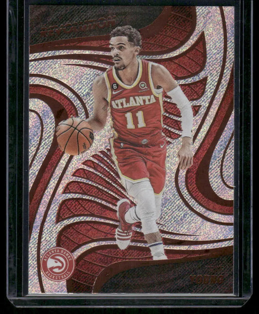 Basketball trading card featuring Trae Young in red uniform dribbling, Panini Revolution Basketball