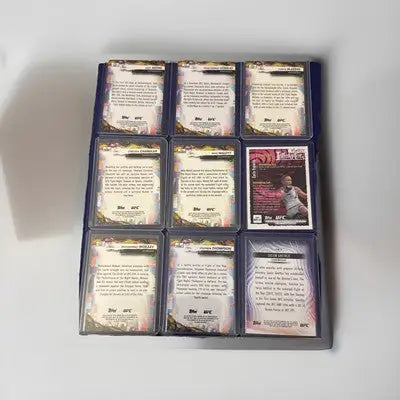Binder page with nine UFC 2022-24 Card Lot collectible trading cards including rookies and vets