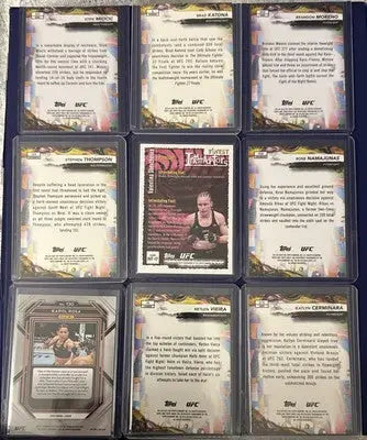 UFC trading card lot featuring Rookies Vets Prizm Refrac and Base cards in protective sleeves