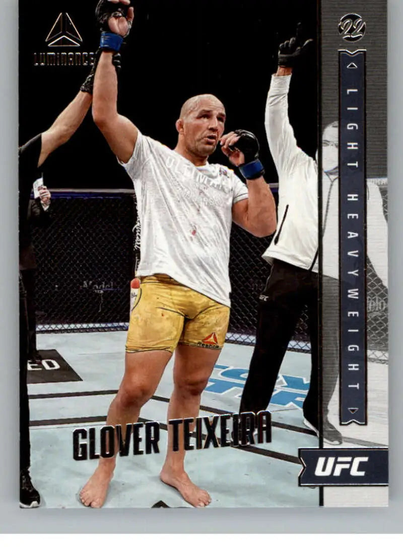 UFC fighter Glover Teixeira celebrates victory in yellow shorts from Panini Chronicles UFC