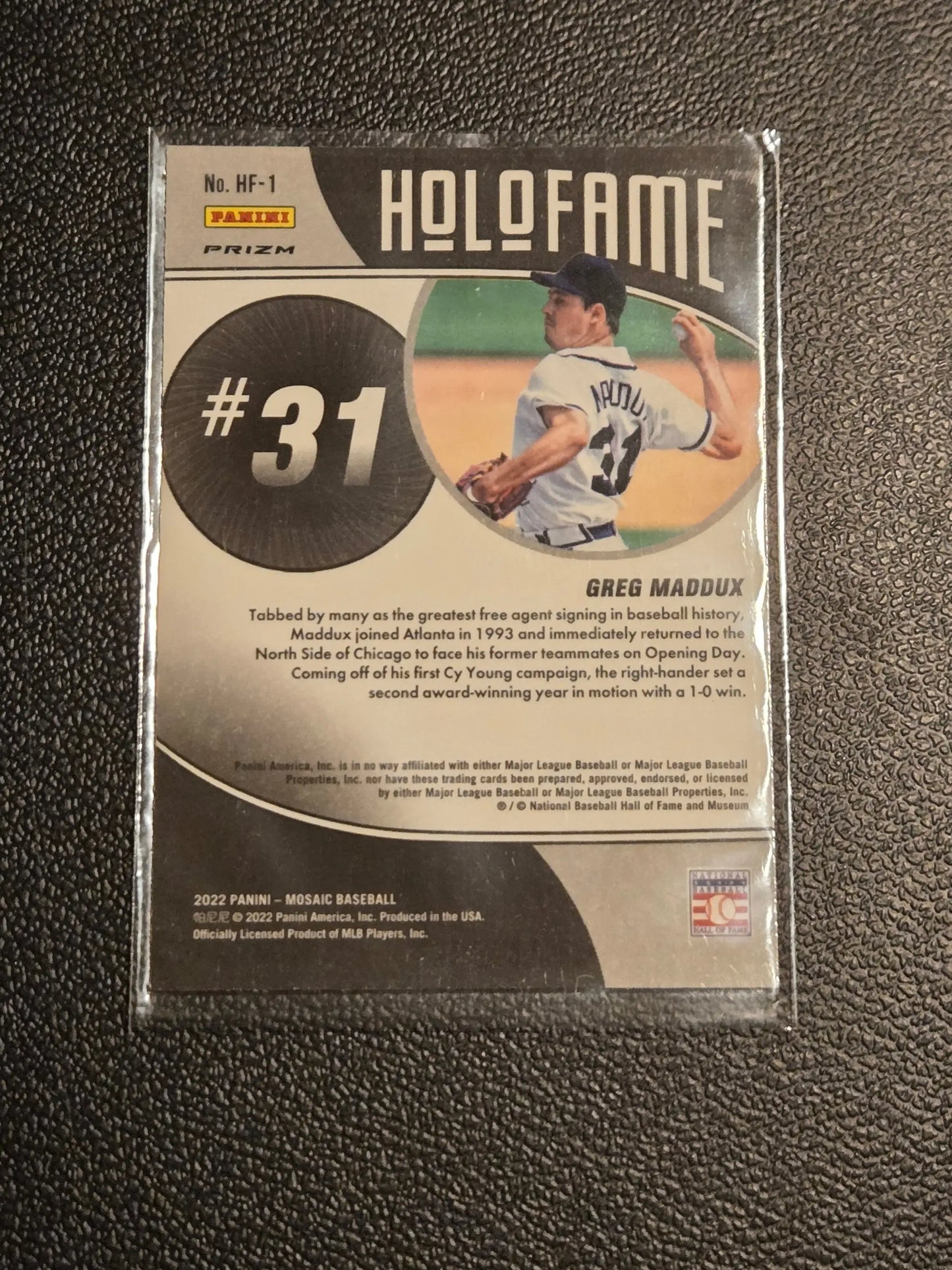 Baseball trading card of Greg Maddux from 2022 Panini Mosaic Maddux Holofame Green Mosaic