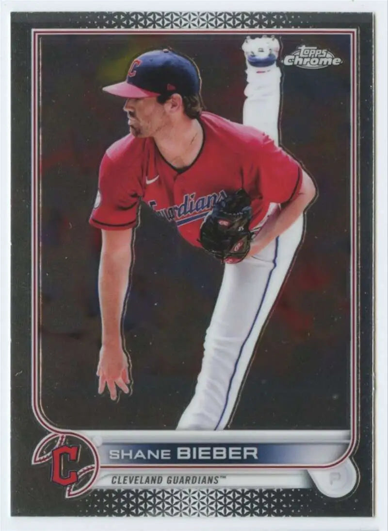 Baseball card of Shane Bieber pitching in red jersey for Cleveland Guardians Topps Chrome