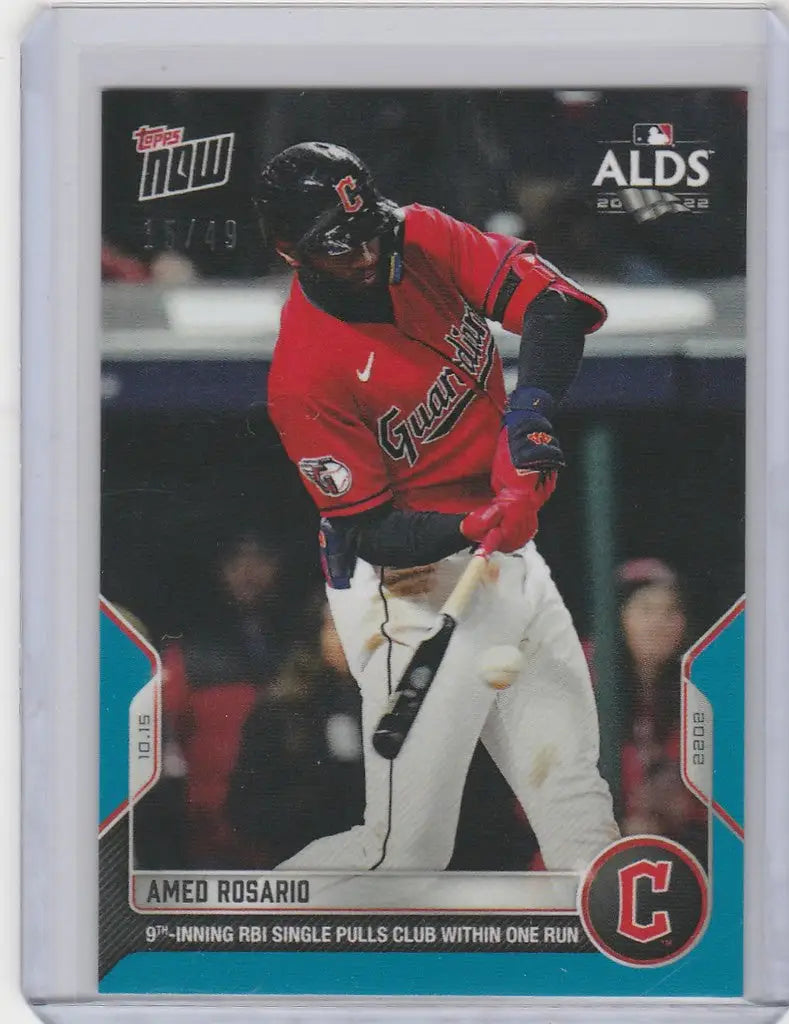 Baseball card of Amed Rosario Cleveland Guardians player swinging a bat in red uniform