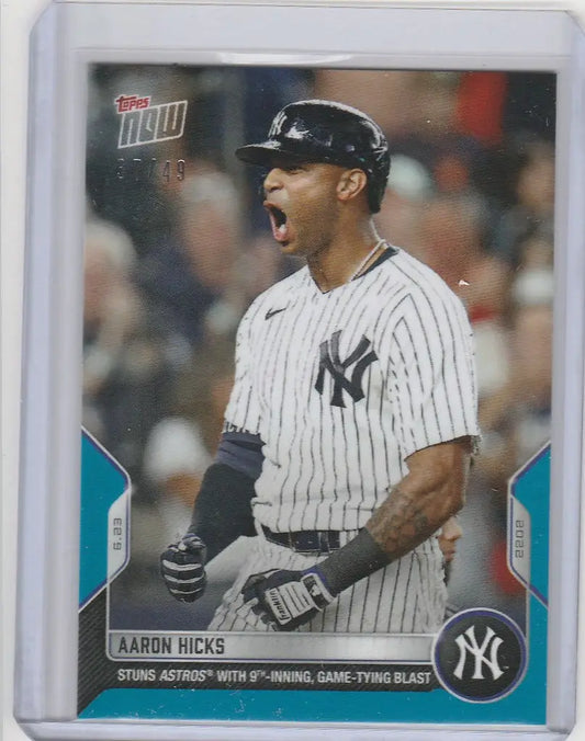 Baseball trading card of Aaron Hicks celebrating with New York Yankees highlights