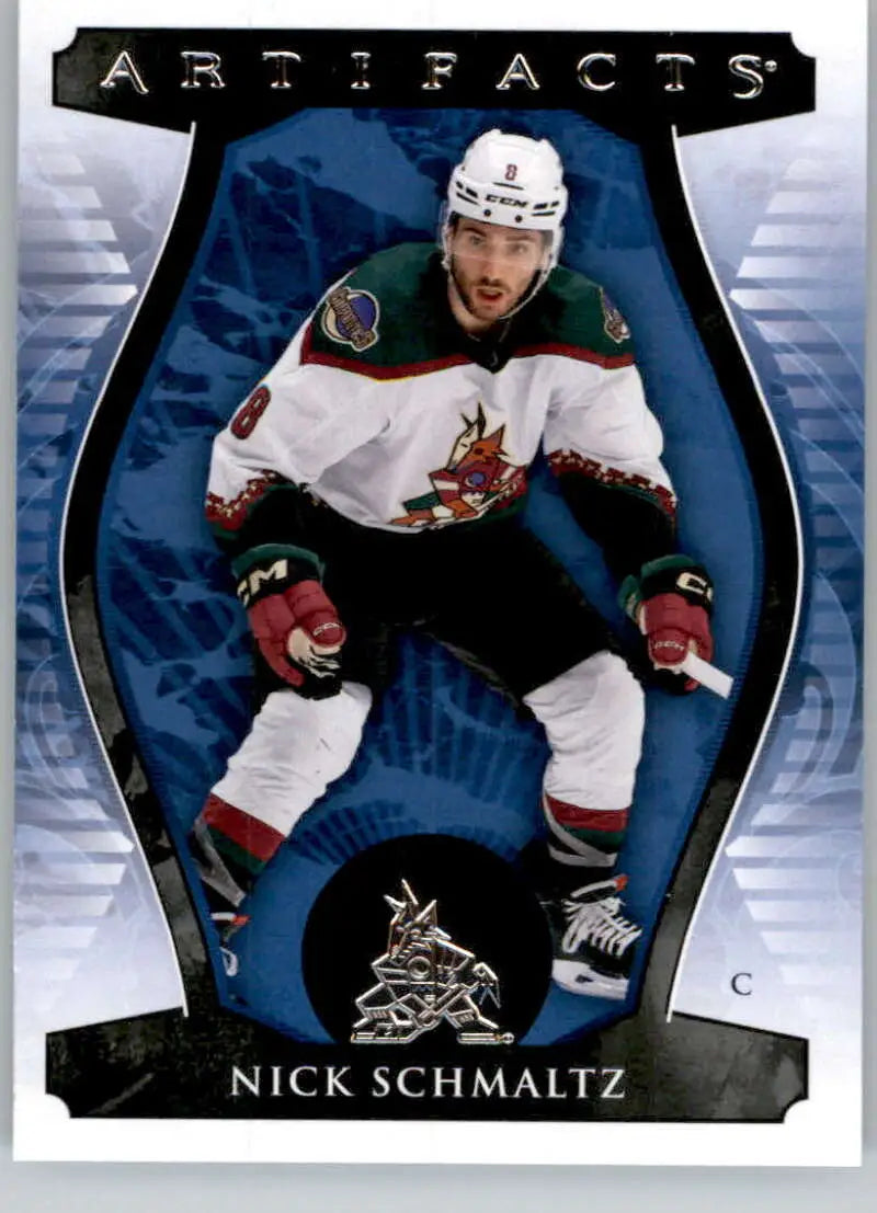 Hockey player in white Phoenix Coyotes jersey for Upper Deck Artifacts Nick Schmaltz card