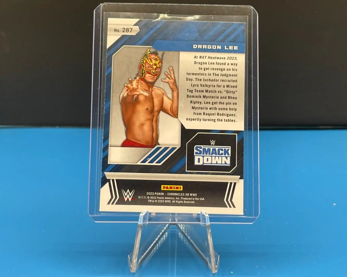 Dragon Lee wrestling card from 2023 Panini Chronicles XR WWE Bronze Parallel #287