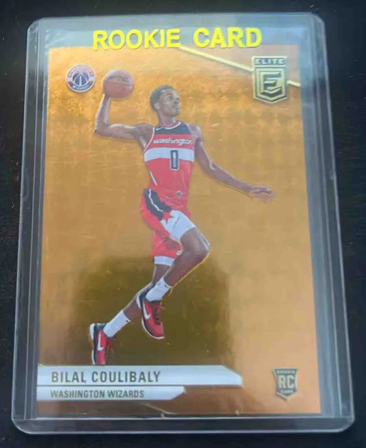 Gold-colored basketball rookie card of Bilal Coulibaly from Panini Donruss Elite Donruss Elite Bilal series