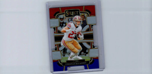 Football trading card of Christian McCaffrey in protective case from 2023 Panini Select featuring Black and Red Prizms Die Cuts