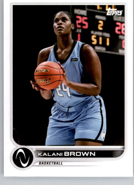 Kalani Brown in light blue uniform holding basketball for Topps Athletes Unlimited card