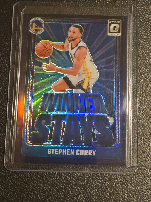 Stephen Curry Winner Stays basketball trading card in protective sleeve for 2024-25 Donruss Optic