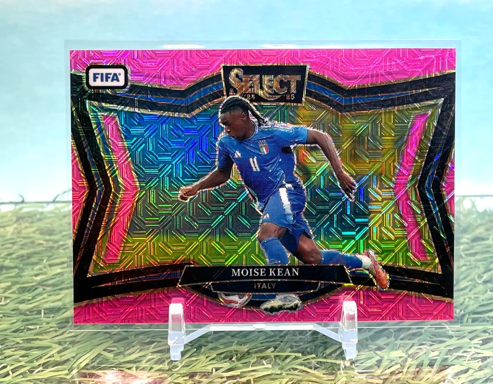 Vibrant pink holographic soccer trading card of Moise Kean in Italy uniform from Select FIFA Moise