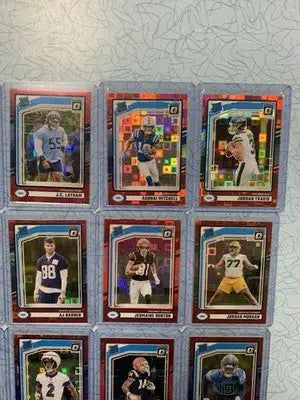 Collection of football trading cards featuring NFL players from Donruss Optic Red Pandora series
