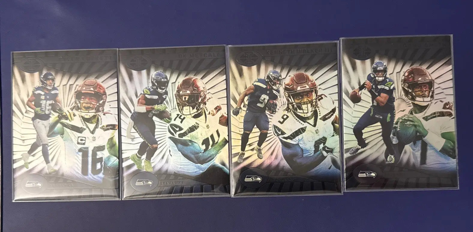 Four Seattle Seahawks football trading cards from 2024 Illusions Emerald Green series