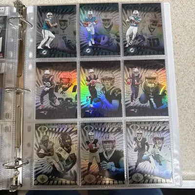 Binder of holographic Panini Illusions trading cards from the 2024 base set