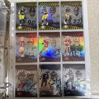 Binder page with nine Panini Illusions trading cards from the 2024 base set featuring football players