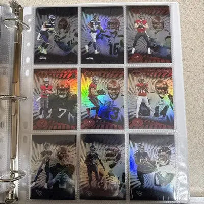 Holographic football trading cards from Panini Illusions 2024 base set on a binder page