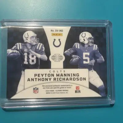 Encased Panini Illusions trading card featuring Peyton Manning and Anthony Richardson
