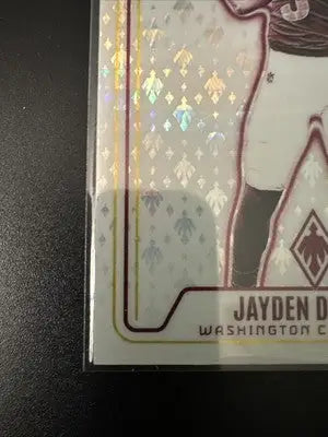 Holographic Panini Phoenix Football trading card featuring Jayden Daniels and Commanders logo