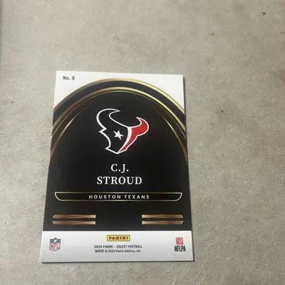 Black and gold Panini Select football trading card featuring Houston Texans C.J. Stroud