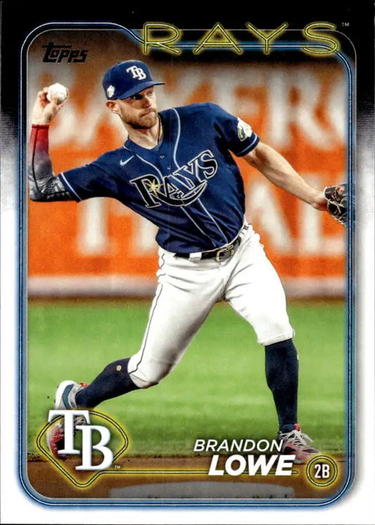 Tampa Bay Rays player in navy uniform making a throwing motion on baseball card