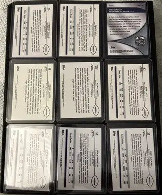 Binder page with nine Topps Chrome Football refractors including Aikman Irvin and White