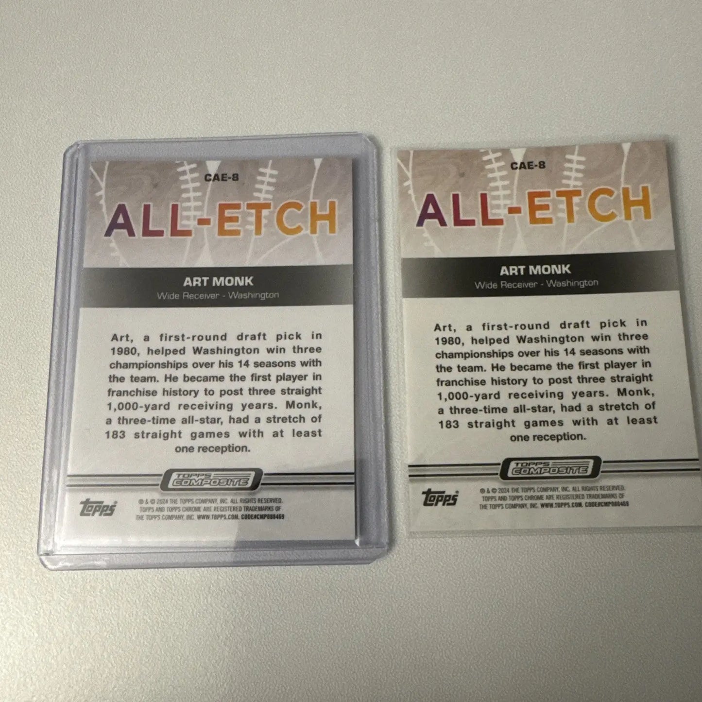 Two Topps Chrome Art Monk Laser Refractor trading cards in protective case