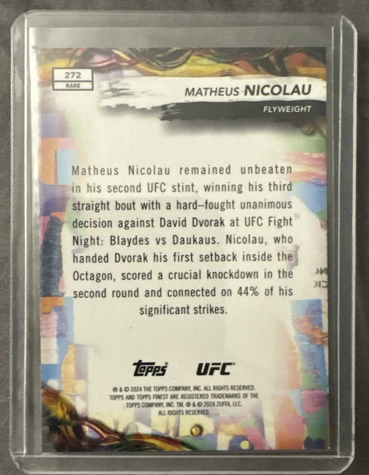 Collectible trading card of Matheus Nicolau in protective case from 2024 Topps Finest UFC
