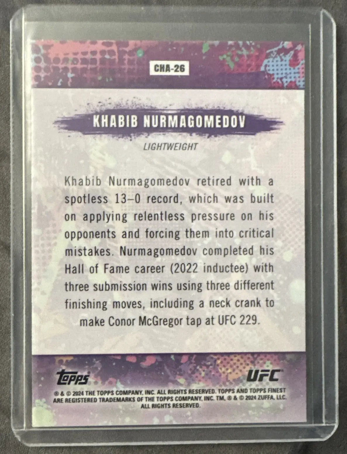 Back of 2024 TOPPS UFC Khabib Nurmagomedov aqua shimmer refractor trading card in protective sleeve