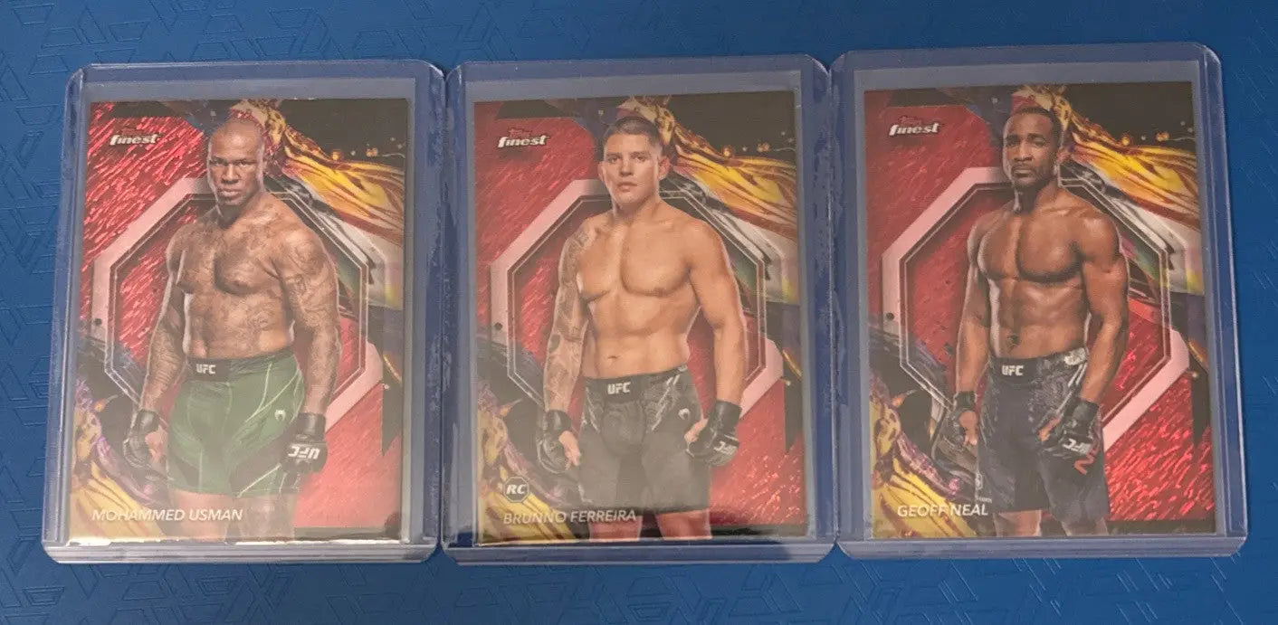 Three UFC trading cards in clear sleeves from 2024 Topps Red Shimmer collection