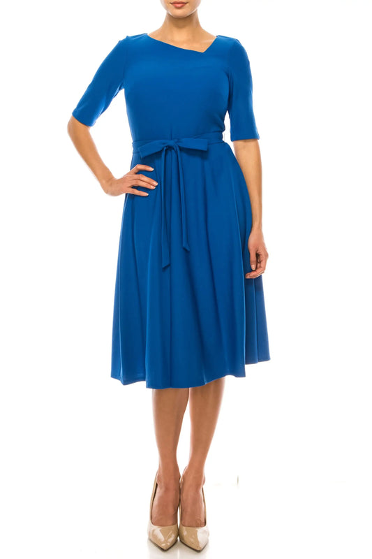 Maison Tara azure blue day dress with asymmetrical neckline and cinched waist