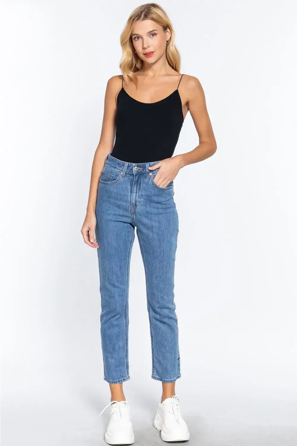 Women’s black ribbed round neck camisole top with high-waisted jeans for a stylish look