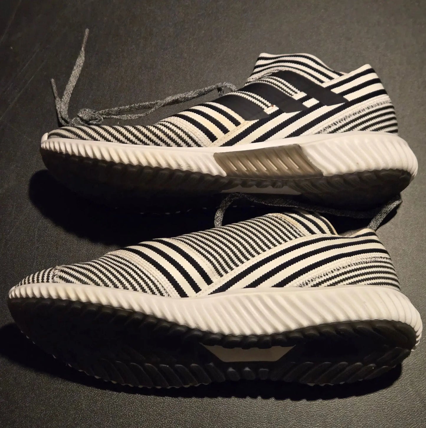 Black and white striped Adidas Sneakers Mens 9 with slip-on knit design and white soles