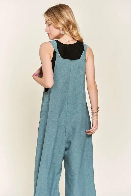 Loose-fitting teal ADORA Knotted Wide Strap Wide Leg Overalls over black tank top