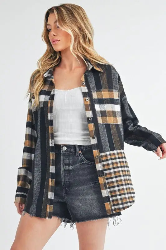 Woman wearing Aem+Co Curved Hem Plaid Button Up Shirt over white top and black denim shorts