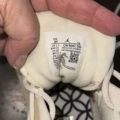 Air Jordan white shoe with size tag from Air Jordan 13 Retro Chinese New Year collection