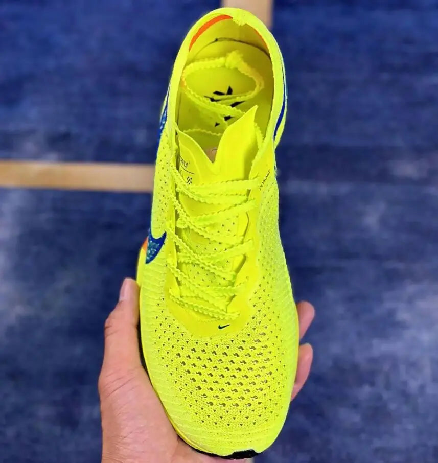 Vibrant neon yellow running shoe with blue accents from Air Zoom Alphafly Next Vaporfly 3 Green Volt, fast shipping available